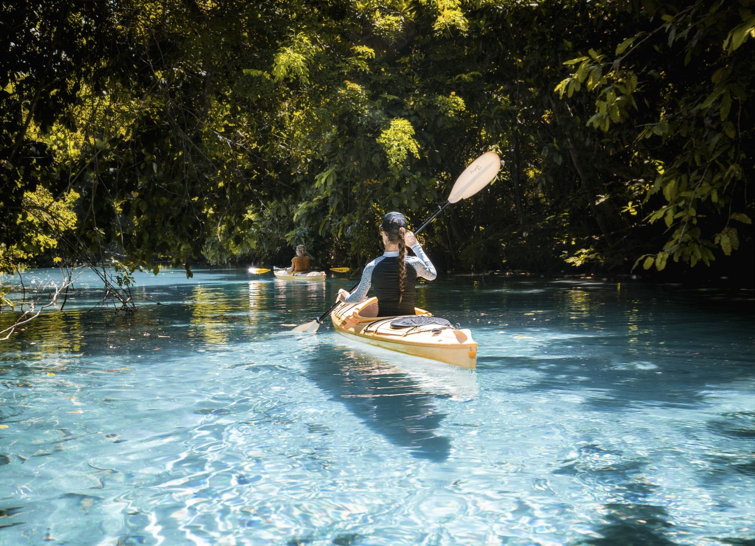 Kayaking on clear blue water in Santo